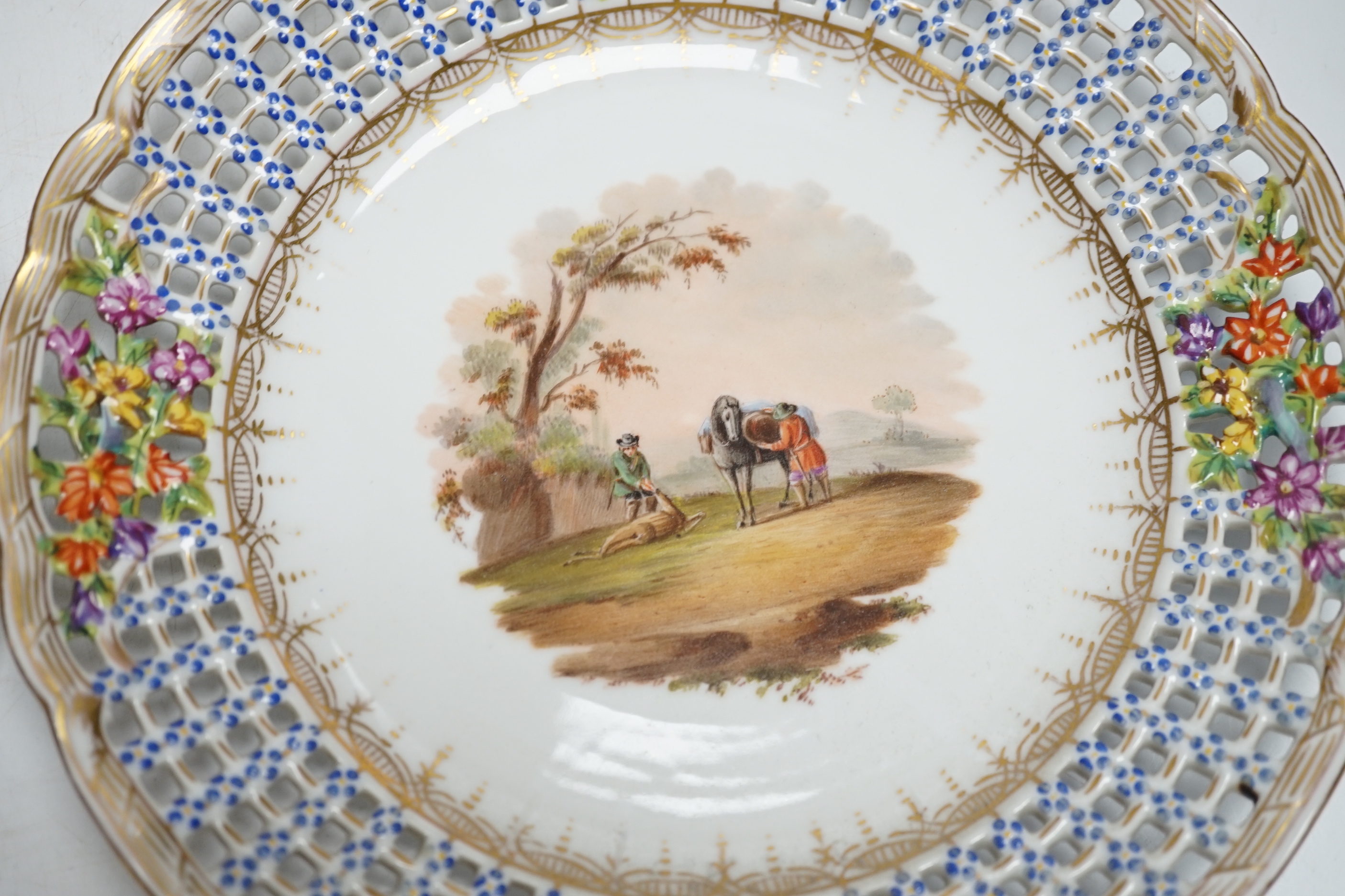 A set of four Dresden porcelain cabinet plates decorated with landscapes, 22cm diameter